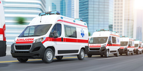 Ambulances in a row on the street of city skyscrapers,