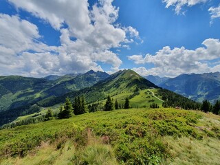 The Krahbergzinken in Schladming on the Planai with clouds and a blue sky