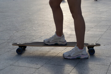 close up woman skateboarder legs skateboarding outdoor