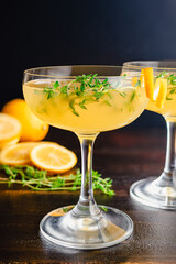 Meyer Lemon and Thyme Bees Knees Cocktails: Gin cocktails made with Meyer lemon juice and garnished...