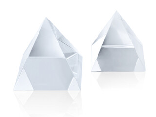 Two different size clear transparent crystal pyramids on white