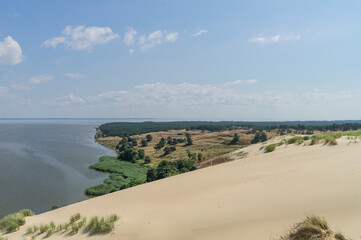 Curonian Spit. Thin, curved sand-dune spit that separates the Curonian Lagoon from the Baltic Sea...