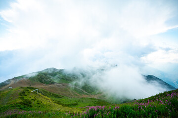 Naklejka na ściany i meble landscape with clouds in mountains Sochi, Russia