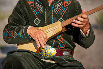 Traditional stringed musical instrument known as Komuz, Kyrgyzstan - obrazy, fototapety, plakaty