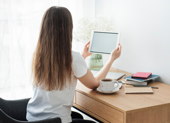 Young girl working at home office