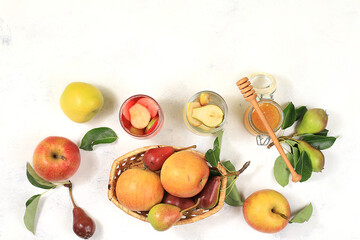 Apple and pear mulled wine with honey, cider, juice or fruit drink in a glass on a sunny table with...