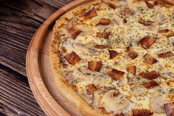 Pizza with mushrooms, cheese and bacon