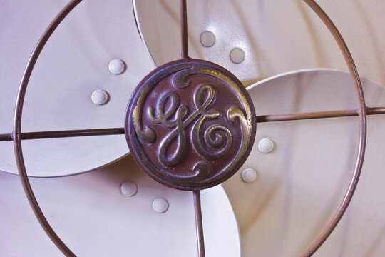 General Electric Logo. GE Divisions Include Aviation, Energy, Healthcare And Lighting.