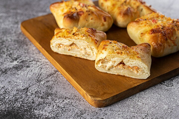 Baked snacks ​​- bread stuffed with cheese and sun-dried tomatoes