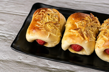 Baked snacks - Bread stuffed with sausage and straw potatoes