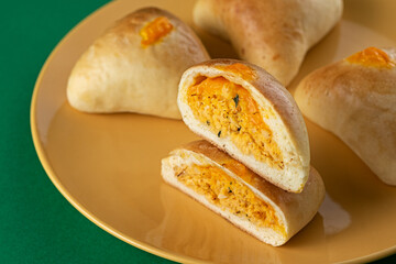 Roasted snacks ​​- Esfiha with cheddar cheese and chicken
