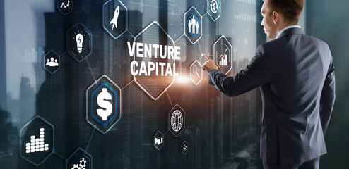 Fototapeta na wymiar Venture capital. Investor capital. Businessman pressing virtual screen inscription