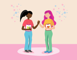 A black and a white girl are holding hands. Hold a notebook with a heart symbol in your hands. Composition on the topic of love, relationships, LGBT, lesbians. Vector illustration.