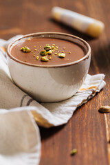 Chocolate pudding with pistachio crumbs on top