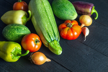 Large set of fresh vegetables for a salad diet on a vintage table. Cooking salad in the restaurant kitchen. Free ad space