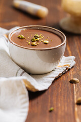 Chocolate pudding with pistachio crumbs on top
