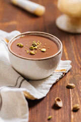 Chocolate pudding with pistachio crumbs on top