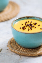 Vanilla pudding on a rustic wooden board