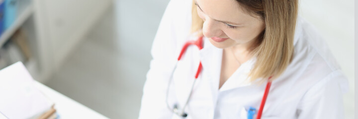 Doctor is typing on keyboard at desktop