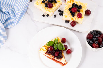 Piece of cottage cheese casserole with cherry jam