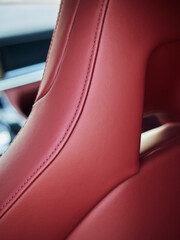 Close-up of red leather car seat of modern sport car