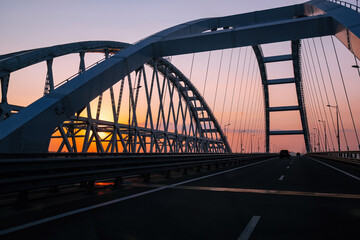 Obraz premium Crimea bridge over Kerch Strait at the evening sunset