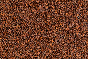 Fresh roasted coffee beans background. Top view.
