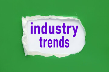 INDUSTRY TRENDS. text on torn paper. test in black letters