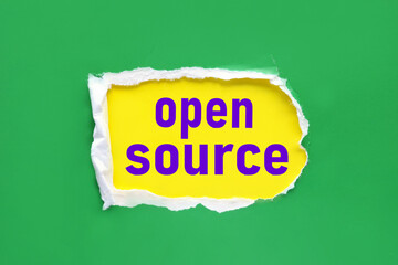 Open Source. text on yellow paper near torn green paper