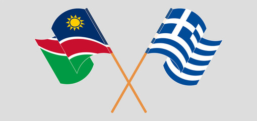 Crossed and waving flags of Namibia and Greece