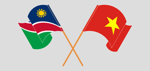 Crossed and waving flags of Namibia and Vietnam