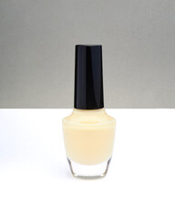 Color nail polish bottles on white and gray background