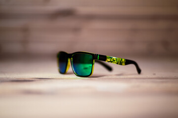 vintage polarising green sunglasses on wooden background
