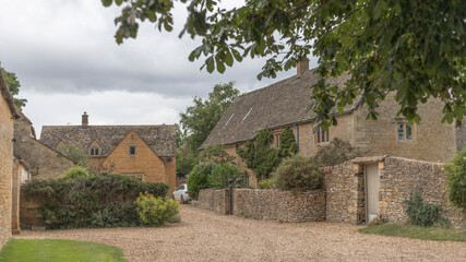 Fototapeta na wymiar Honey coloured stone cottages in a village