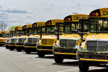 Yellow school buses parked near the high school