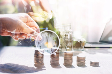 business people working at desk with piggy bank box.business finance saving and investment concept. hand put money coin into piggy bank for saving money wealth.