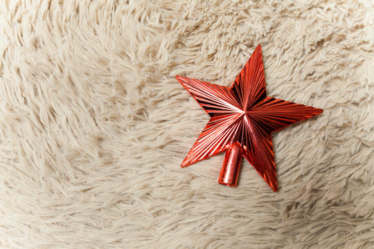 Red Christmas star seen from above. Top view. Christmas decoration. Christmas concept. Star concept. Space for text.
