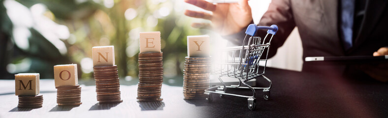 stacking money coins and a house model.save and investment for buy house concept .for the...