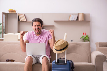 Young man preparing for trip at home