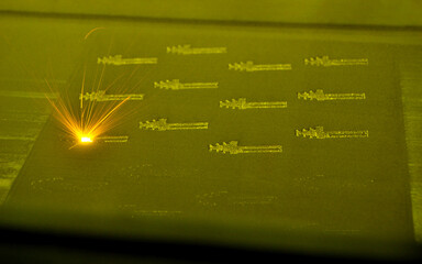 3D printer prints object from metal powder. Metal is sintered under laser