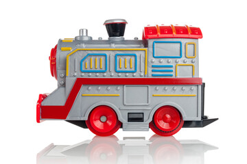 Toy children's steam locomotive, battery-powered gray train, electric, isolated on a white background, side view, children's railway