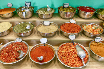 Spices and herbs in bowls are on display at the market in Old City, Jerusalem, Israel.