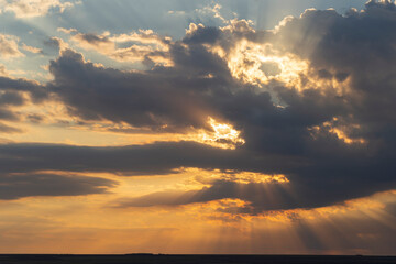 The evening sunset. Panorama. Majestic Storm Clouds. Tragic gloomy sky.