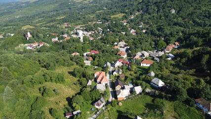 Fototapeta na wymiar Panorama with hills, forest and village.Rosia Montana village.
