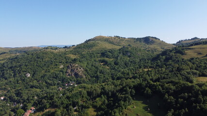 Fototapeta na wymiar Panorama with hills, forest and village.