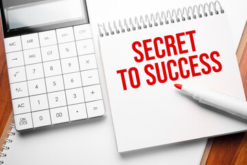 Notepad with text Secret to Success on wooden background with calculator and red marker