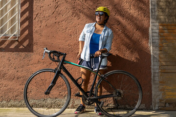 portrait of a mexican urban cyclist laughing