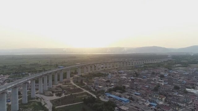 New Chinese railway line with an 8-km-long viaduct. Railway Bridge Menghua. 1817 km is the longest railway line in China. Menghua, Inner Mongolia. (aerial view)