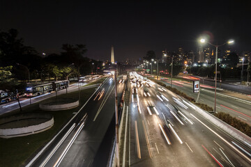 Fototapeta na wymiar Traffic on 23 de Maio Avenue, near of Ibirapuera Park, in Sao Paulo