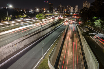 Fototapeta na wymiar Night time lapse of traffic on the famous 23 de Maio Avenue in Sao Paulo, Brazil. This avenue run past Ibirapuera Park.